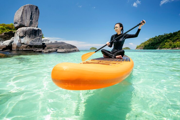 asian-woman-relax-beach-with-sup-board-lipe-island-summer-season-thailand