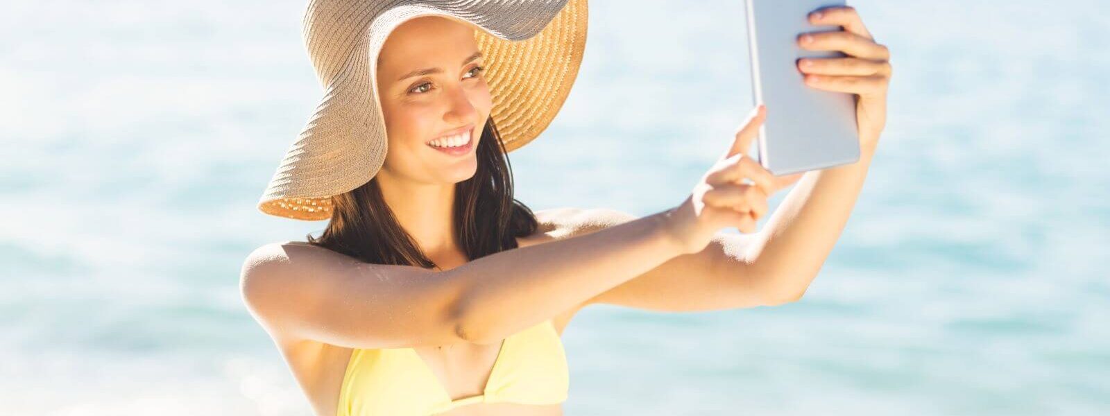 pretty-woman-taking-selfie-beach-phuket-krabi-phang-nga-andaman-sea-islands-thailand