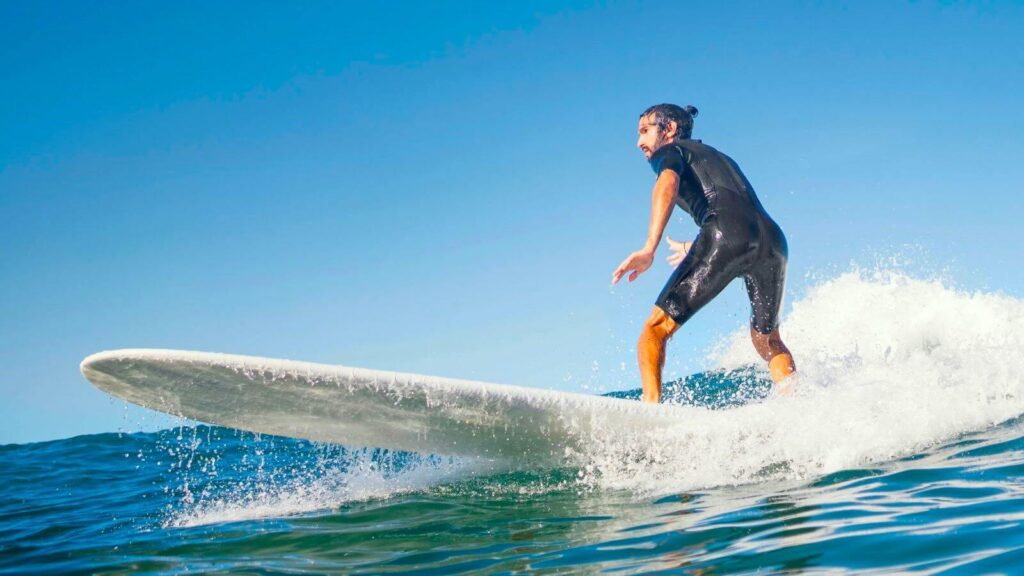 young-man-surfs-ocean-waves-phuket-krabi-phang-nga-andaman-sea-islands-thailand