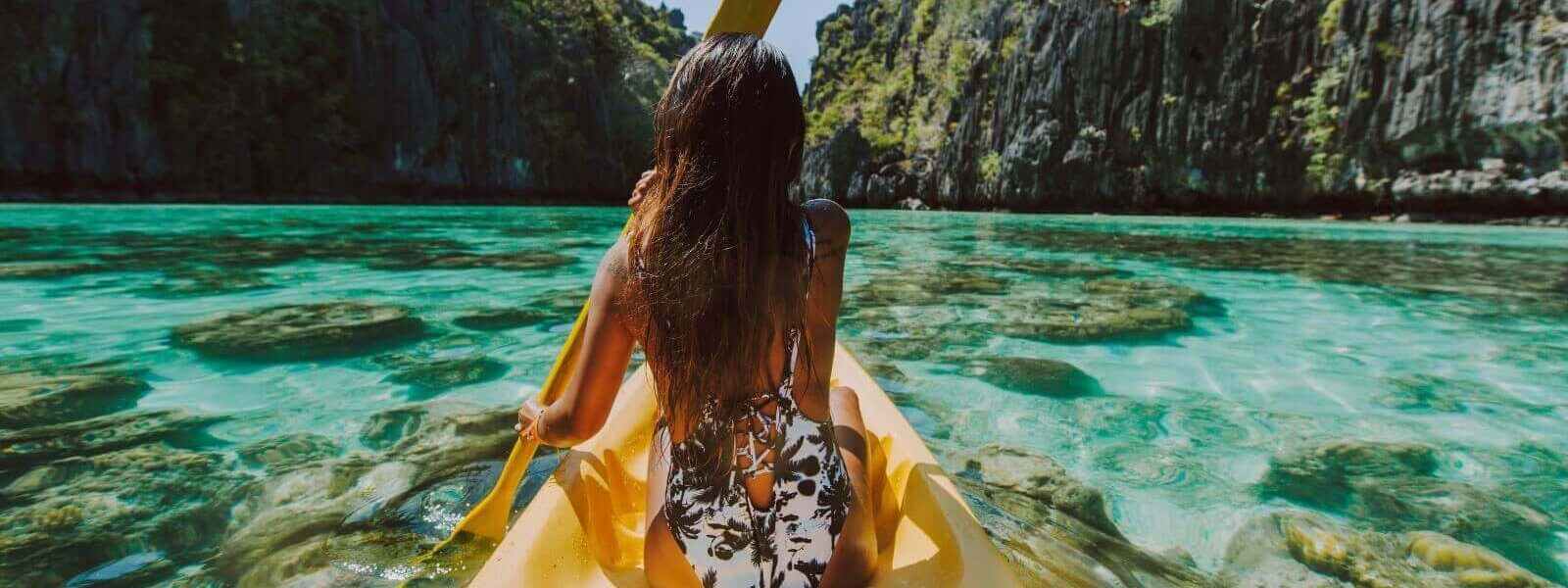 woman-kayaking-in-phang-nga-bay-andaman-sea-islands-phuket-tours