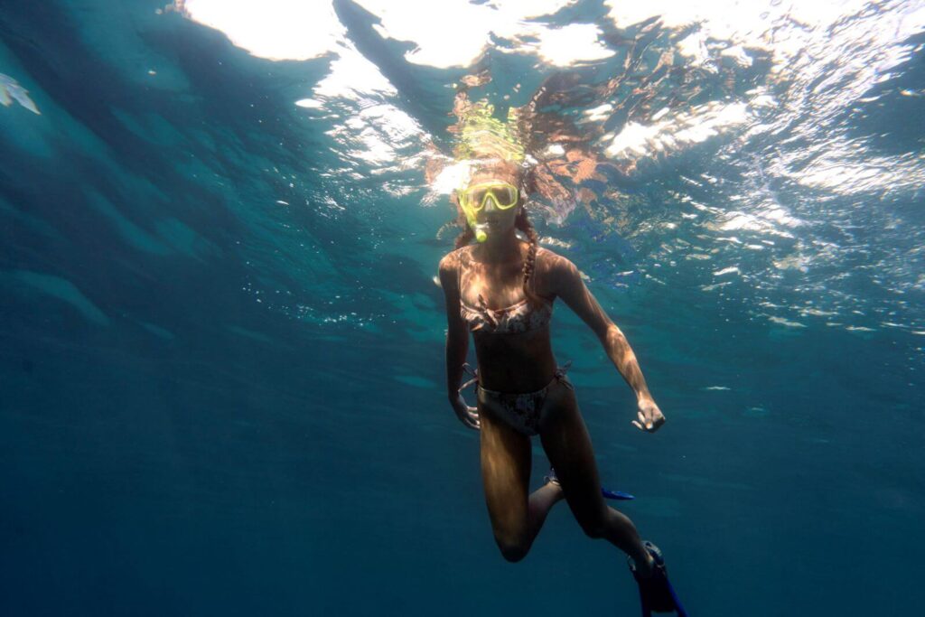 woman-with-scuba-gear-swimming-ocean-andaman-sea-phi-phi-islands