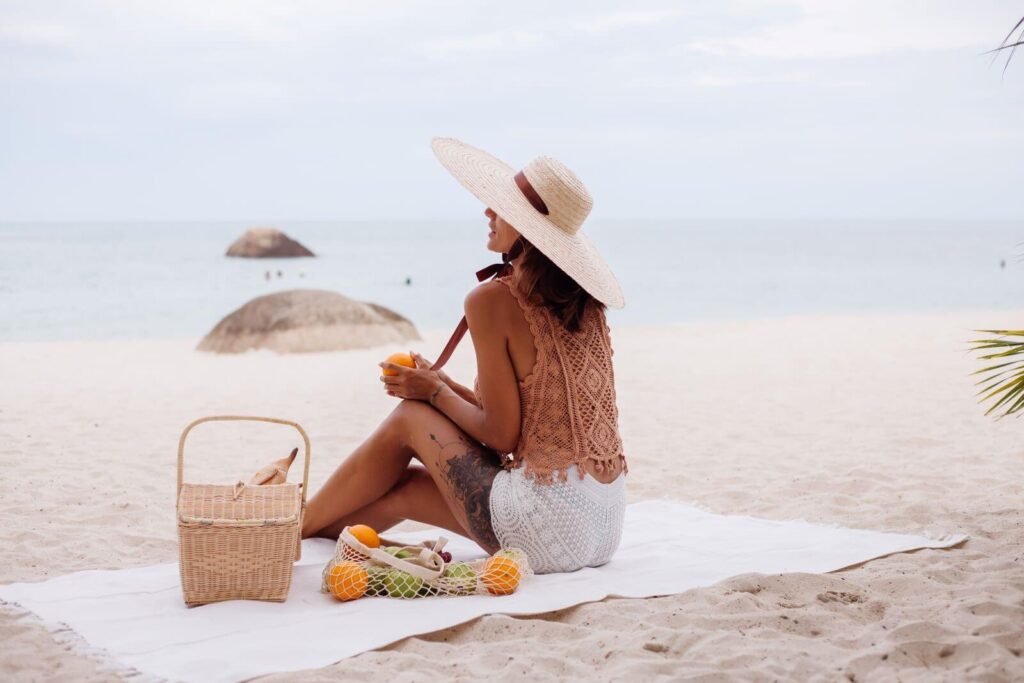 young-pretty-caucasian-tanned-fit-woman-knitted-clothes-ware-natural-hat-on-beach