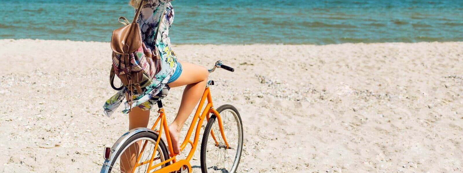 young-sportive-woman-eco-traveling-phuket-beahes-by-bicycle