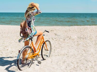 young-sportive-woman-eco-traveling-phuket-beahes-by-bicycle