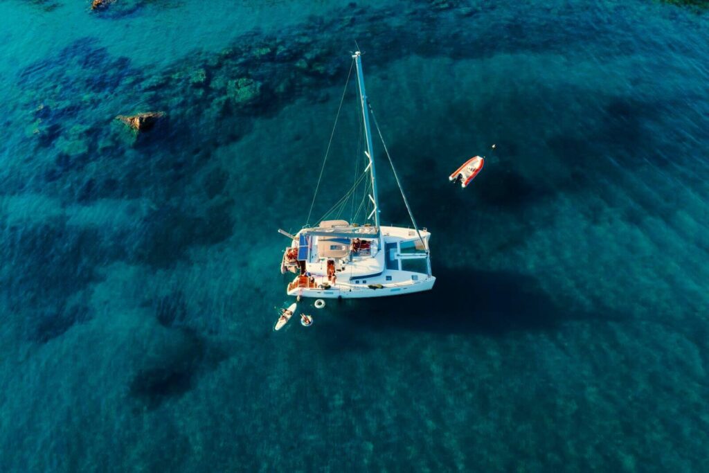 amazing-top-view-catamaran-anchored-blue-sea-summer-travel-background-cruise-vacation