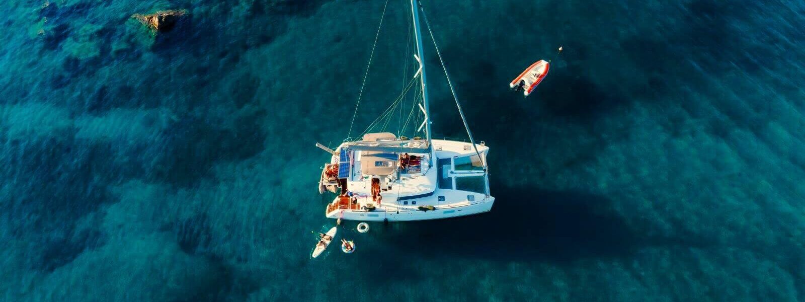 catamaran-anchored-blue-sea-summer-travel-background-cruise-vacation