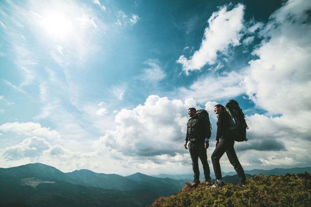 couple-standing-mountain-hiking-to-railay-viewpoint-phuket-phang-nga-krabi-andaman-sea-islands-tours-thailand